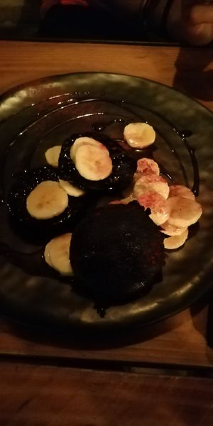 Carbon pankake with banana and syrup at Soda in Alba