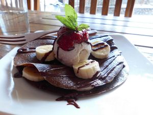 Banana Maple Sirup Pancake with Raspberry Jam, Bananas, Chocolate-Maca Sauce und Vanilla Icecream 🙂 at The Seeds of Life in Ubud