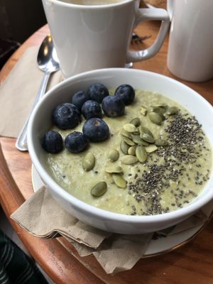 matcha porridge with blueberries and chia/pumpkin seeds. ordered without banana. at Cherry Reds Cafe and Bar in Birmingham