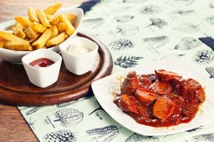 Germayn speciality: Currywurst with French Fries and home-made curry sauce at Bunte Burger Cologne in Cologne