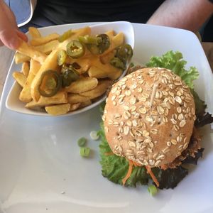 Beyond Sausage Burger (Special) + fries with cheese and chilis  at Bunte Burger Cologne in Cologne