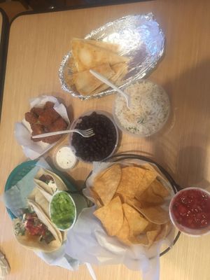 tacos, quesadillas, cilantro lime rice & black beans, chips w/ guac & salsa, & my favorite avocado fries w/ vegan ranch dip !!! at The Wild Burrito in Wildwood