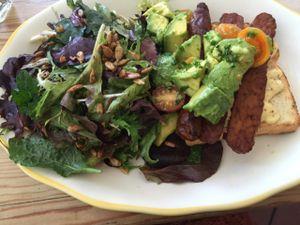 Avocado TLT (maple tempeh, lettuce, tomato) on millet bread with side salad  at Kitchen Mouse in Los Angeles