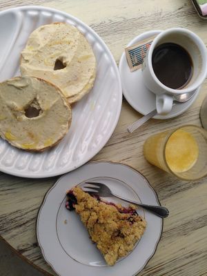 Hummus bagel, plum crumble, coffee, orange juice at Zoe Food in Gran Canaria