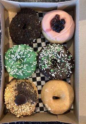 Half dozen vegan donuts to go at Glam Doll Donuts - Eat Street in Minneapolis