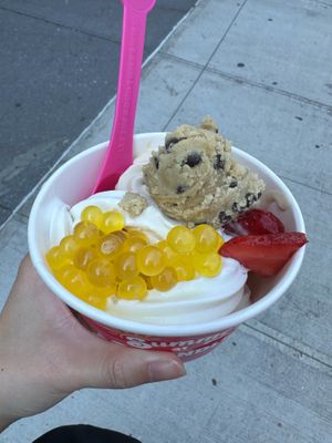 Oat Milk Iced Latte & Oat Milk Vanilla vegan frozen yogurt w/ vegan cookie dough, mango bursting bubbles, and berries at 16 Handles - Cobble Hill  in Brooklyn