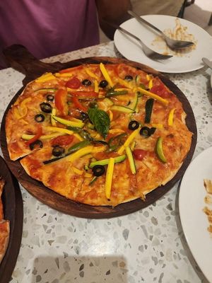 Vegan pizza at Onomato All Day Diner • Bistro in Mumbai