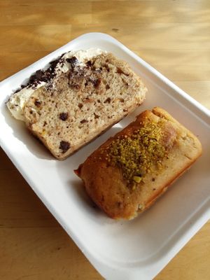 More scrumptious takeaway vegan treats; banana cake, and halawa (halva) and pistachio. at The Cheeky Pea in Kingston Upon Thames