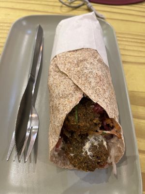 Falafel wrap w lemon coriander hummus and all the veggies  at The Cheeky Pea in Kingston Upon Thames