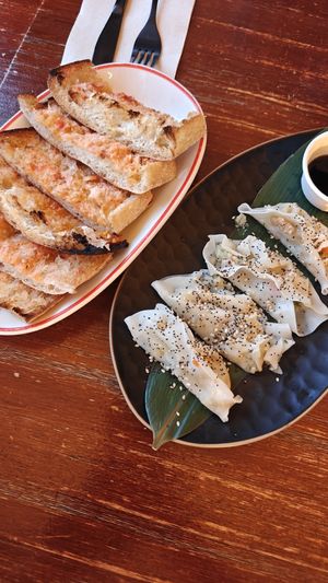 Coca bread and gyozas at Buffala L’Escala in Cataluña