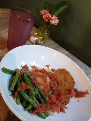 Porq Chops & Applesauce: smoked seitan porq chops, pink apple slaw, mashed potatoes, green beans at Fifth House in Omaha
