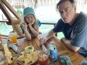 Guac and chips, ginger iced tea, passion fruit juice  at Leaf Eaters Cafe in Bocas Del Toro