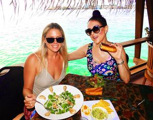 That is a chicken salad on the left that my friend is eating. Fish is also on the menu. Vegan food is the majority. I am eating the vegan panini, salad & guacamole on the right. at Leaf Eaters Cafe in Bocas Del Toro