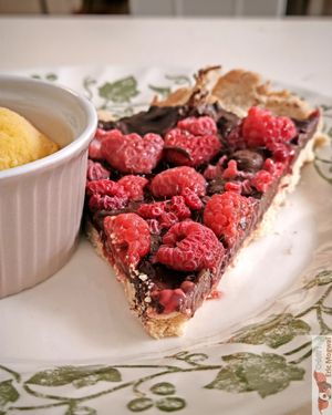 chocolate and raspberry tart with mango ice cream at Chat-Rivari Café in Paris