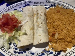 Potato enchiladas with the cheese sauce, and sour cream removed at Frida's Modern Mexican in Athens