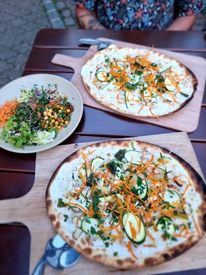 Dinner two flamkuche with cococnut yoghurt and salad on the side at L'Acoustic in Selestat