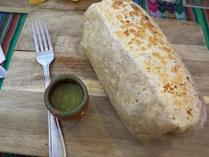 Veggie Burrito (vegan) with fork for scale! at Mas Amor in Chico