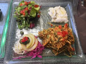 Raw zucchini, fermented veggies, cashew cheese at Divine Earth in Seminyak