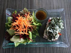 Almond bread with cashew cheese and chives.  at Divine Earth in Seminyak