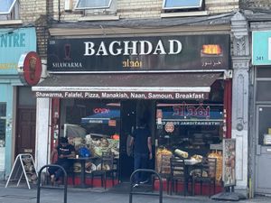 Jumbo falafel wrap made with fresh bread (cooked in the tandoor oven) filled the way I like it: with smashed falafels, lettuce, tomato, fries, garlic sauce and tahini sauce  at Baghdad in London