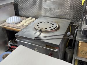 Bread being made fresh in front of you  at Baghdad in London
