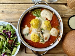 Shakshuka with mozzarella, vegetable salad  at Anastasia in Tel Aviv