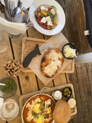 Kapreza salad, fucassia, and shakshuka  at Anastasia in Tel Aviv