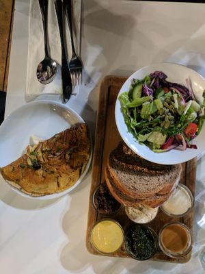 Breakfast with chickpea omlete  at Anastasia in Tel Aviv