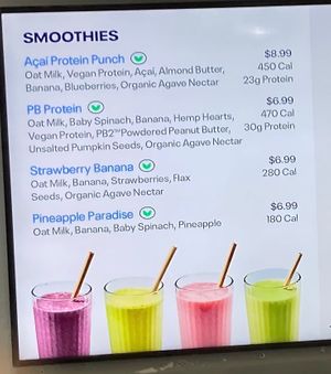 Wall sign for smoothies (v= vegan) at Just Salad - Lenox Hill in New York City