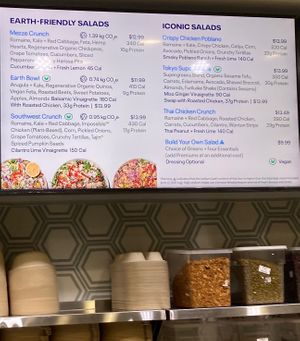 Wall sign (V = vegan) at Just Salad - Lenox Hill in New York City