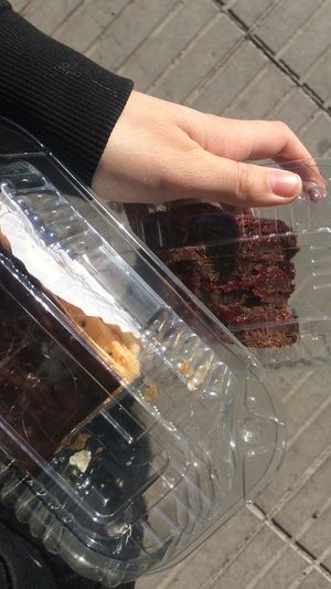 Chocolate raspberry layered cake and pastry slice with chocolate on top at Newen Vegetariano in Santiago