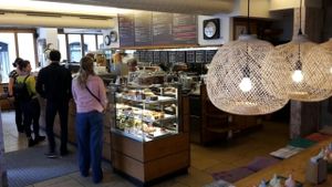 Counter and cake section to the right lots of options on menu board at Das Voglhaus in Konstanz