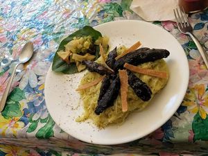 Rice noodles with marinated portobello mushrooms, vegan cheeze and fermented vegetables at Pura Vida in Zihuatanejo