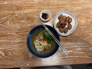 Dumpling soup with extra vegan sausage! Delicious!!! And that chili oil is my favorite too!! at Lao Ba Cha in Bali