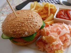 Burger with salad and potato-fries at Flow Food in Bialystok
