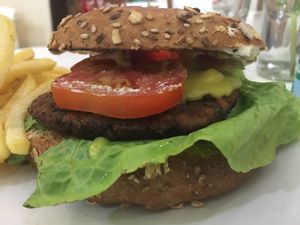 Kobus burger on oat bagel. Yummy!! at Konu Bar in Buenos Aires