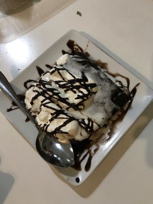 Warm brownie with cream  at Konu Bar in Buenos Aires