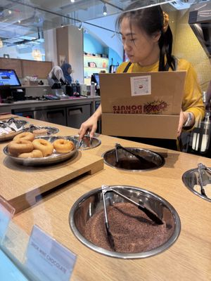 Select your choice of toppings  at OMG! Decadent Donuts Singapore – Margaret Market in Singapore