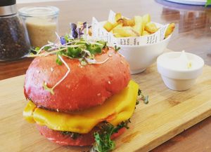Vegan burger on beetroot bun at Dad and Dave's Cafe in Yarraville