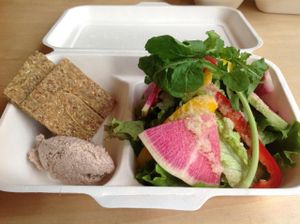 Takeout lunch available:  Salad, raw onion bread and mock tuna made with nuts at Rejuve in Tokyo