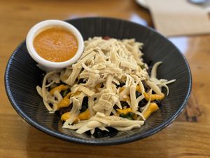 Rice bowl with sauce on the side  at P.S. and Co. in Philadelphia
