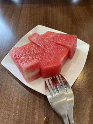 Complimentary watermelon  at Lotus Plant Based Kitchen in Manchester