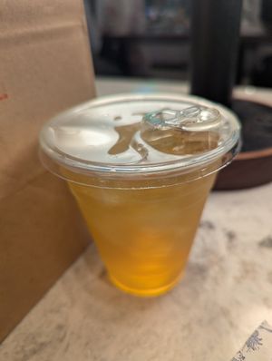 Unsweetened peach mango iced green tea at {petite} maman in New York