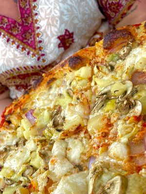 Pizza slice  at Hatool HaYarok - The Green Cat in Tel Aviv