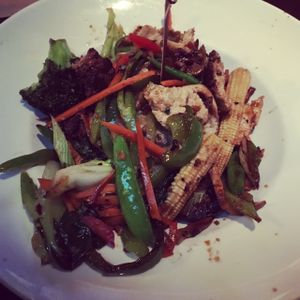 Gardein chicken stir fry with veggies and brown rice at Yard House in Miami