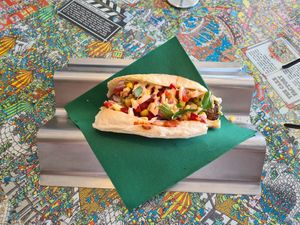 Vegan minx hotdog with vegan mayo on top at Run Amuk in South Fremantle