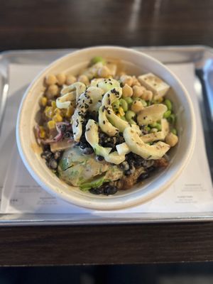  Vegetarian Lover Poke Bowl- vegan chicken, tofu, black beans, sweet corn, edamame, cucumber, sesame shoyu sauce, avocado, red cabbage, green onion, and sesame seeds  at Natural Kitchen in Orange Park