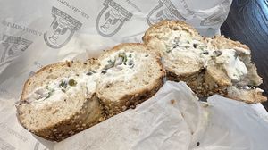 Tofu scallion cc with red onions and capers on toasted whole wheat everything bagel  at Utopia Bagels in New York