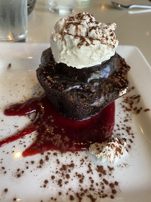 Vegan chocolate cake with raspberry coulis and coconut whip at Bravo in Jackson