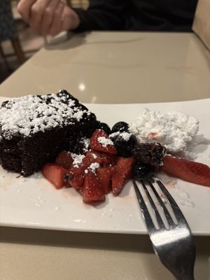 Vegan chocolate cake with mixed berries and coconut whipped cream   at Bravo in Jackson